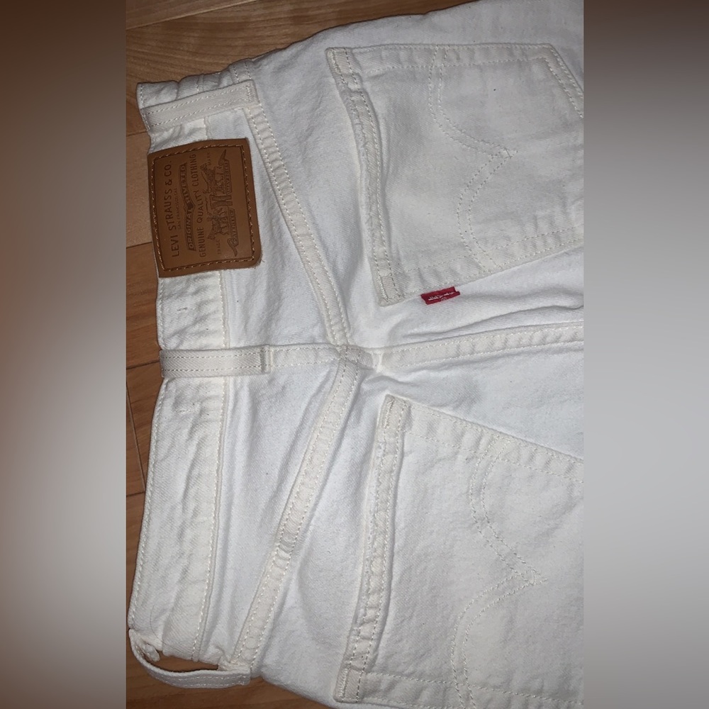 White Levis jeans with distress design